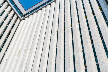 underside panoramic and perspective view to steel blue glass high rise building skyscrapers, business concept of successful industrial architecture