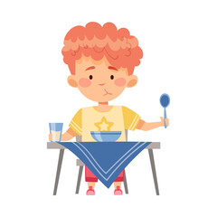 Boy Character Sitting at Table Eating Porridge for Breakfast Vector Illustration