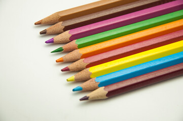 colored pencils on a white background. education concept. illustration of training.