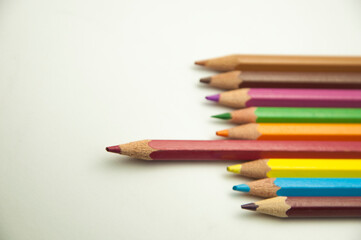 colored pencils on a white background. education concept. illustration of training.