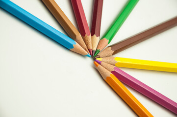 Fototapeta premium colored pencils on a white background. education concept. illustration of training.