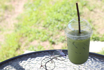 Iced green tea on table