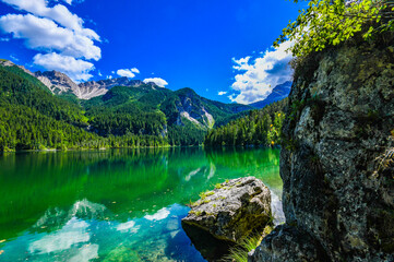 Fototapeta na wymiar Spectacular landscape view Italian mountain lake in Dolomiti Alps, Summer Season. Tovel Lake in Trentino, Parco Adamello. Visit Trentino.