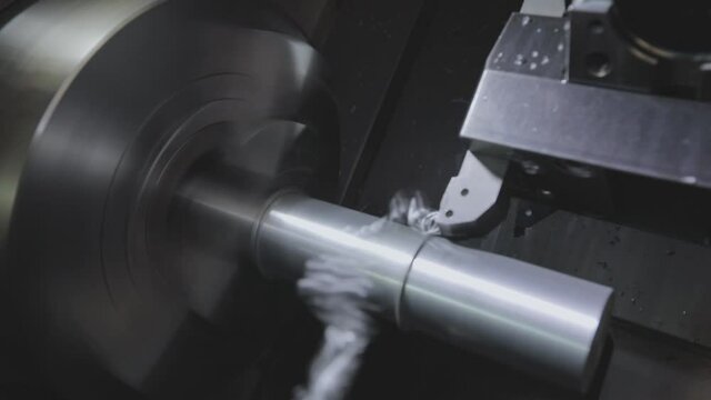 CNC lathe machine. Processing a metal part in a CNC machine. Lathe, cnc machine