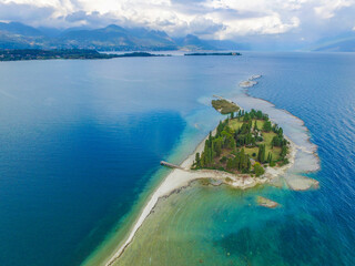 Special View by Drone - Flying on Isola dei Conigli. Moniga, Manerba in Garda Lake for an italian...