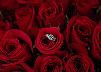bouquet of roses with engagement ring