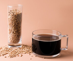 A cereal drink to replace coffee in the diet. Cup on a beige background. Copy space