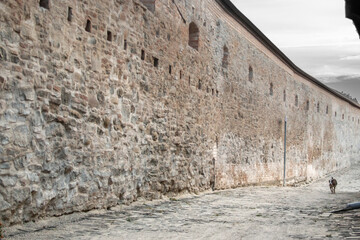 Old medieval building with broken walls and vintage style