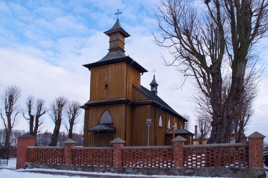 the 19th-century wooden church of Saint Leonard in Chociszewo, Poland in winter