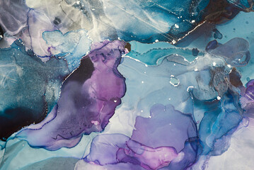 Abstract colorful background, wallpaper. Mixing acrylic paints. Modern art. Marble texture. Alcohol ink colors translucent