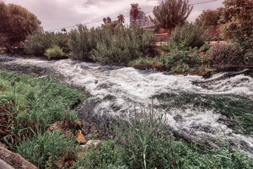 The turbulent Duden River roars to its end in the form of a giant waterfall in the city of Antalya