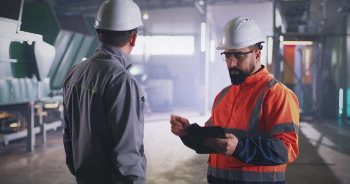 Engineer and supervisor during inspection in workshop