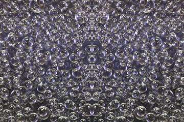 A pattern of gray-brown rings and brown-lilac spheres of various diameters is symmetrically located on a brown background. 