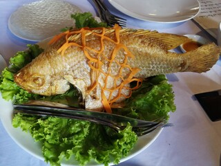 Close up of cooked fished with fine decoration