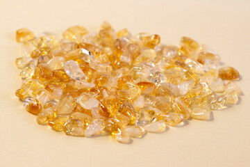 Citrine yellow gem geode crystals geological mineral on light linen Narrow focus line, shallow...