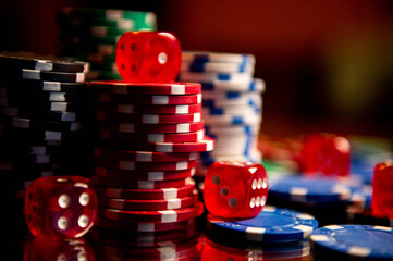 Casino. Poker. Game pieces and dice are on the table. Game chips for betting in gambling. Dice. Poker chips. 