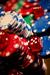 Casino. Poker. Game pieces and dice are on the table. Game chips for betting in gambling. Dice. Poker chips. 