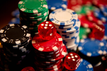 Casino. Poker. Game pieces and dice are on the table. Game chips for betting in gambling. Dice. Poker chips. 