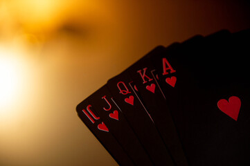 Playing cards lie on the mirror surface of the table. Gambling. Poker. 