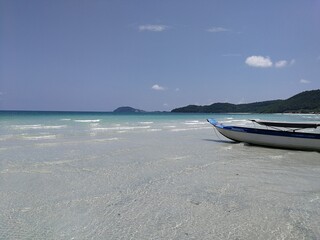 Phu Qoc island beach with white sand and boats in Vietnam