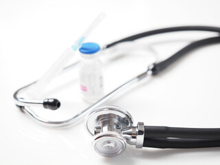 close up bottle vaccine and syringe. medicine stethoscope