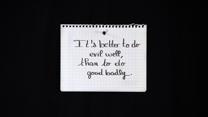 Hand written message on a ripped notebook sheet:  better to do evil well, that to do good badly