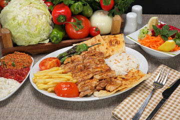 grilled chicken waist with rice pilaf and fried potato