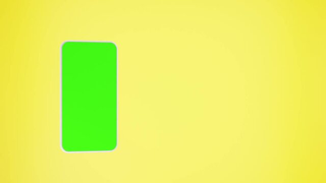 Phone white with chromakey green screen, smartphone isolated on yellow background. Template, mock up for mobile app or advertisment. Electronic digital device, cellphone blank touch screen display.