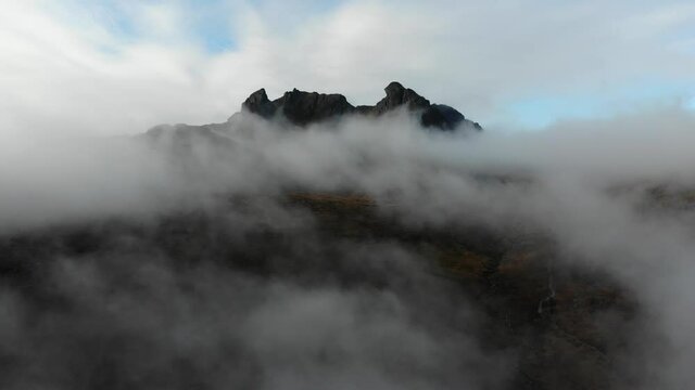 Aerial footage capturing one of Scotland's most iconic mountain summits the Cobbler. Situated in Argyll & Bute in the Scottish Highlands this footage captures it's summit dissapear above the clouds.