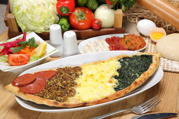 special turkish pitta four seasons pita karadeniz pita with minced meat, cheddar, spinach and chopped meat