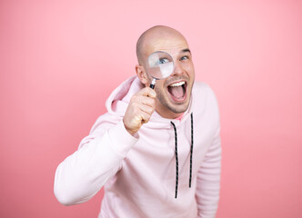 surprised looking through a magnifying glass