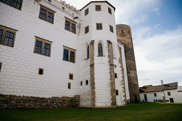 Fototapeta na wymiar Courtyard of medieval castle and chateau, historical palace complex, arcades and white renaissance archs, National cultural landmark, Jindrichuv Hradec, South Bohemia, Czech Republic