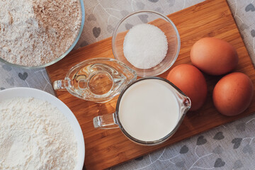 Cooking for someone special concept. Ingredients for homemade pancakes. Top view, selective focus