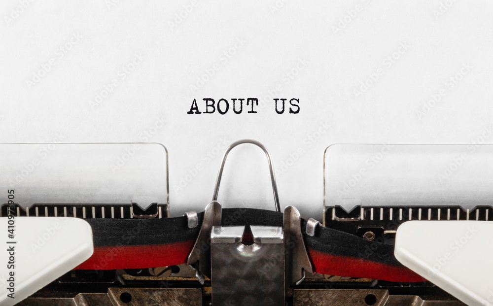 Fototapete text about us typed on retro typewriter