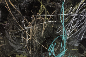 Multicolored doodles with chalk on a black board