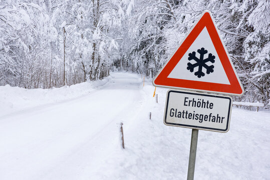 Road Sign Warns Of Ice And Snow At Winter