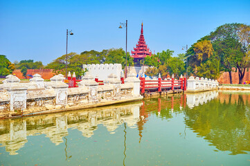 The bridge across the moat of the Royal Palace in Mandalay, Myan