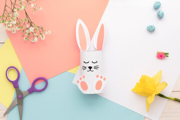 Easter bunny decoration. Paper cut DIY holiday white hand made rabbit.Top view, copy space . funny flatly.