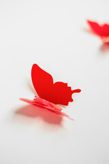red butterflies on a white background