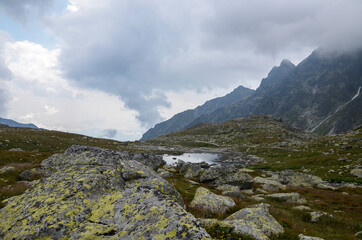 Fototapeta na wymiar View of the Mengusovska valley in the mountains near the Hincovo pleso pond in the High Tatras. Slovakia. Hiking and travel destination