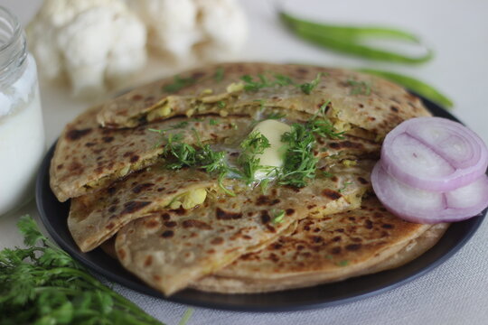 Gobi paratha or cauliflower paratha is a type of paratha or parantha or flatbread, that is stuffed with flavoured cauliflower and vegetables.