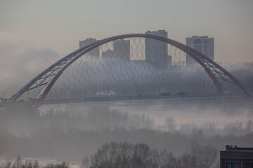 Bugrinsky bridge in winter foggy morning