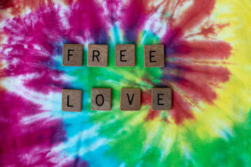 Toronto, Ontario, Canada — 'Free love' spelled out in wooden letters on multicoloured swirl...