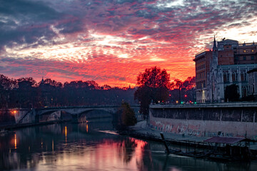 sunset over the river Tiber, Rome Italy. colorful red sky