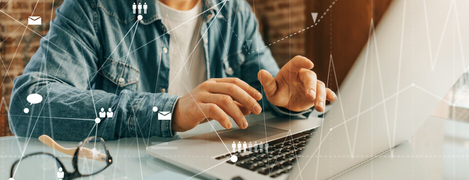 Male hands with laptop. Man working remotely at home. Concept of networking or remote work. Global business network.