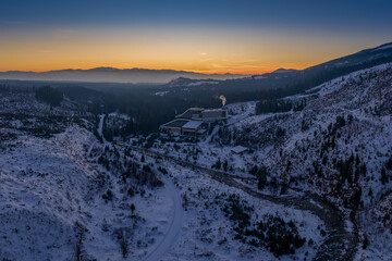 snowy valley with river and road after sunset with Permon