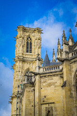 Fototapeta na wymiar the beautifully carved bell tower of the gothic Cathedral St Cyr Ste Juliette in Nevers, a city located in Burgundy, France