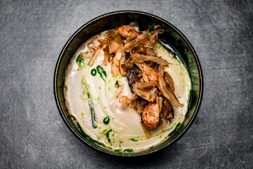 beautiful plate with delicious meat dish with sauce and shrimps