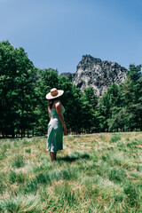 Woman in straw hat overlooking  mountains Serra da Estrela Portugal