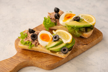 Tuna, eggs, olives  and avocado sandwiches.